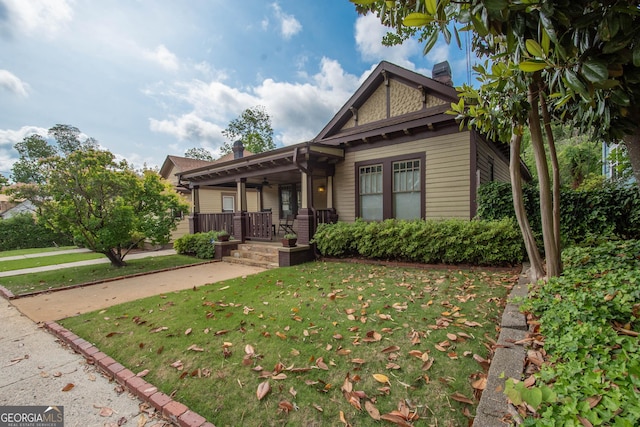 20 Salbide Ave, Newnan, GA 30263 - view of front of property with a porch, a front yard, a chimney, and ceiling fan