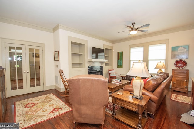 20 Salbide Ave, Newnan, GA 30263 - living room featuring french doors, ornamental molding, ceiling fan, wood finished floors, and built in shelves
