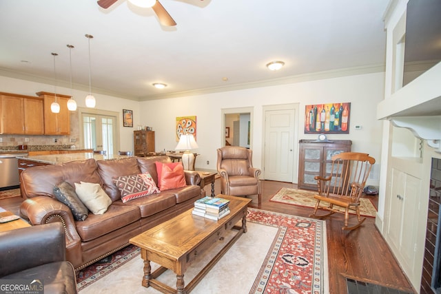 20 Salbide Ave, Newnan, GA 30263 - living area with crown molding, wood finished floors, a ceiling fan, and a fireplace
