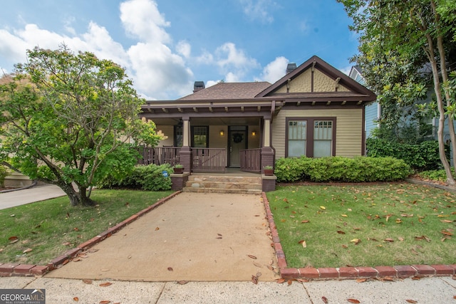 20 Salbide Ave, Newnan, GA 30263 - view of front facade featuring a front lawn, a porch, and a chimney