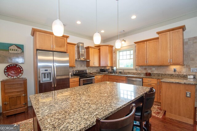 20 Salbide Ave, Newnan, GA 30263 - kitchen featuring stainless steel appliances, wall chimney range hood, a kitchen island, tasteful backsplash, and recessed lighting