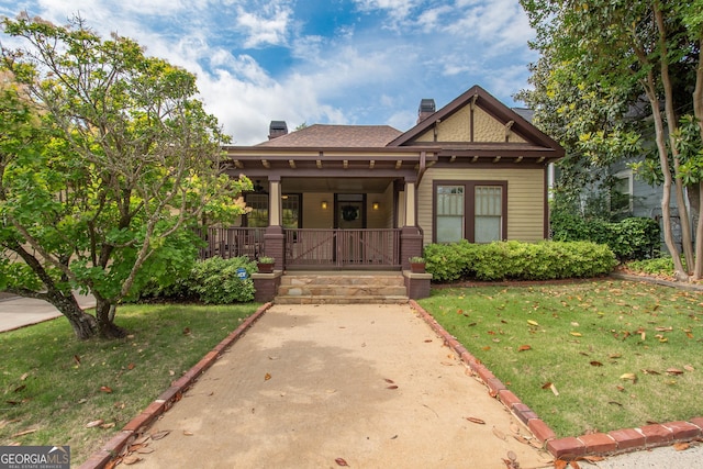 20 Salbide Ave, Newnan, GA 30263 - view of front of property featuring covered porch, a chimney, and a front yard