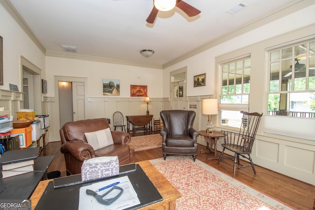 20 Salbide Ave, Newnan, GA 30263 - living room with wood finished floors, crown molding, a ceiling fan, plenty of natural light, and a decorative wall