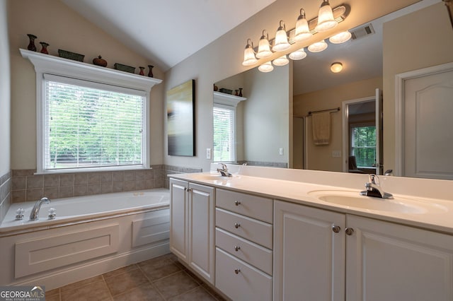 200 Hidden Spring Way, Athens, GA 30605 - bathroom featuring tile patterned floors, vaulted ceiling, a bath, and double vanity