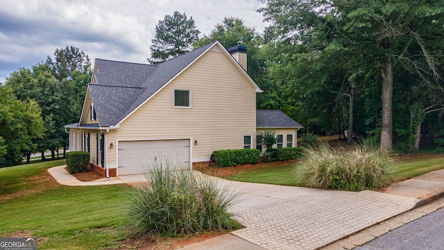 200 Hidden Spring Way, Athens, GA 30605 - view of side of home with driveway, a chimney, a yard, a shingled roof, and an attached garage