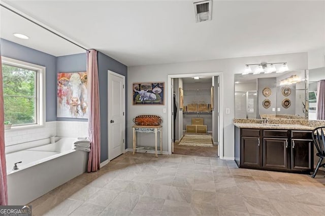 9225 Maple Run Trl, Gainesville, GA 30506 - bathroom with vanity, a garden tub, and a shower