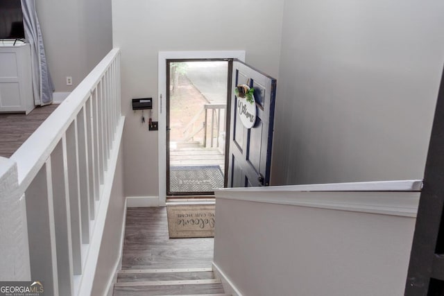 1220 Wade Green Cir NW, Acworth, GA 30102 - stairway featuring wood finished floors and baseboards