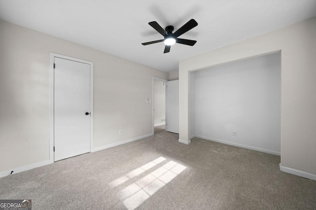 unfurnished bedroom with carpet floors and baseboards