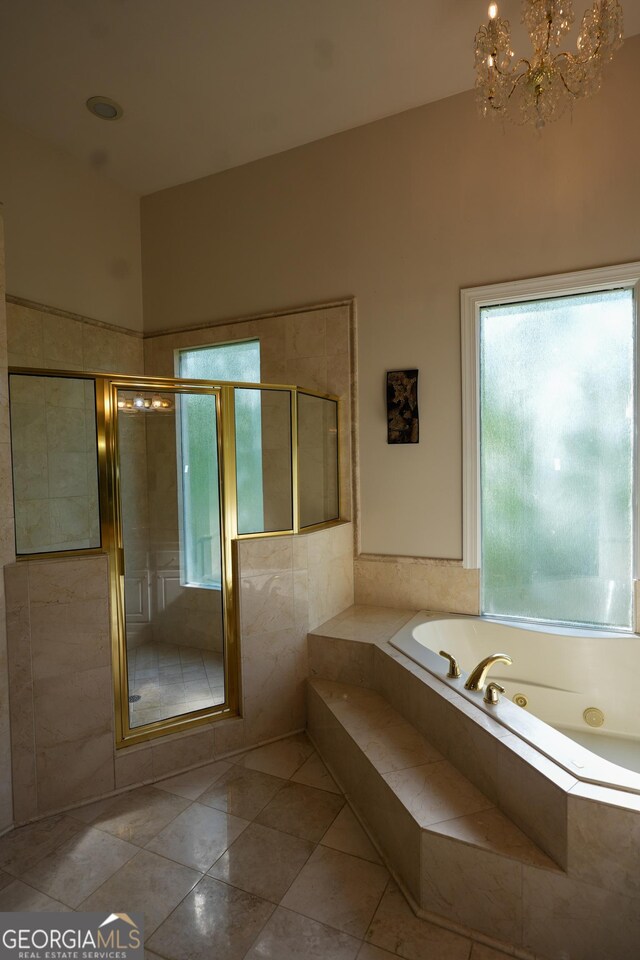 1010 Forest Overlook Dr SW, Atlanta, GA 30331 - full bathroom with a jetted tub, a stall shower, tile patterned floors, and a chandelier
