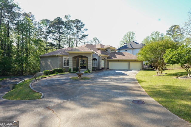 1010 Forest Overlook Dr SW, Atlanta, GA 30331 - view of front of home featuring curved driveway and a front yard