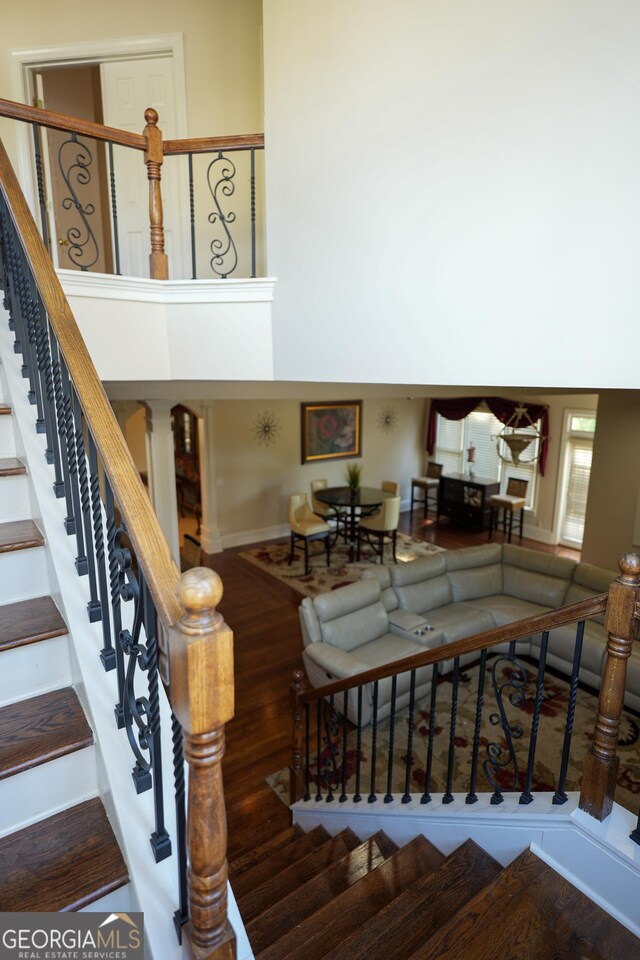1010 Forest Overlook Dr SW, Atlanta, GA 30331 - stairs featuring baseboards and wood finished floors