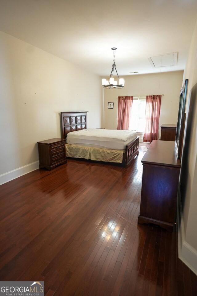 1010 Forest Overlook Dr SW, Atlanta, GA 30331 - bedroom featuring attic access, dark wood finished floors, and baseboards
