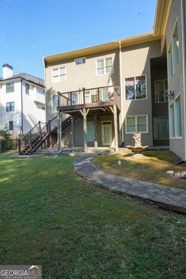 1010 Forest Overlook Dr SW, Atlanta, GA 30331 - back of property with stairway, stucco siding, a yard, and a deck