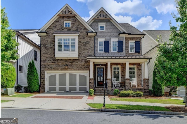828 Olmsted Ln, Duluth, GA 30097 - craftsman-style home with driveway, brick siding, a porch, and a garage