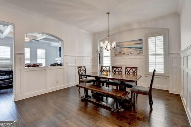 828 Olmsted Ln, Duluth, GA 30097 - dining room with a decorative wall, dark wood-style flooring, healthy amount of natural light, crown molding, and ceiling fan