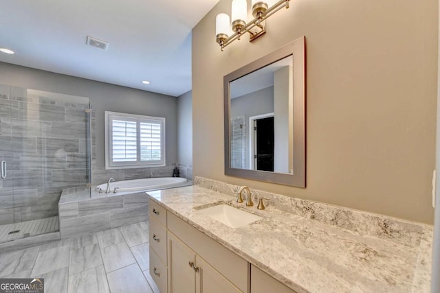828 Olmsted Ln, Duluth, GA 30097 - bathroom with a garden tub, a shower stall, vanity, and recessed lighting
