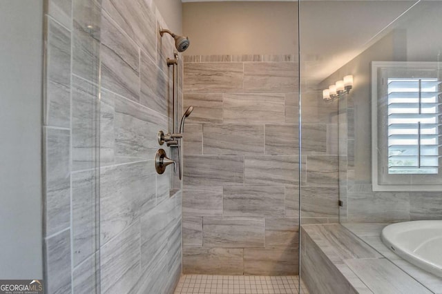 828 Olmsted Ln, Duluth, GA 30097 - bathroom featuring tiled shower and a garden tub