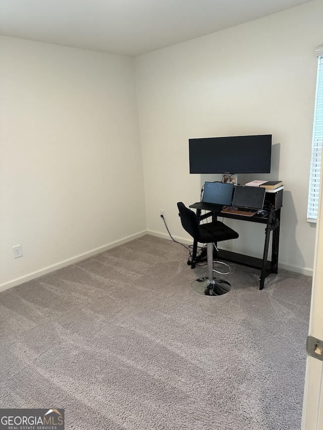 home office with carpet flooring and baseboards