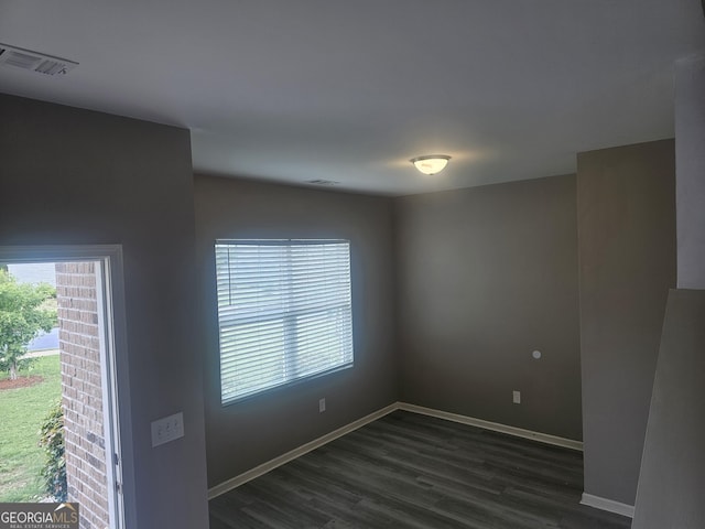7253 Lacey Dr, Douglasville, GA 30134 - empty room with dark wood-style floors and baseboards