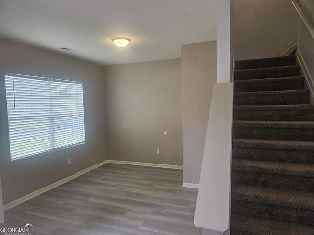 7253 Lacey Dr, Douglasville, GA 30134 - stairway with wood finished floors and baseboards
