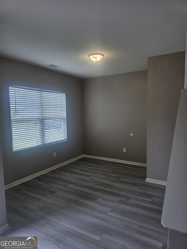7253 Lacey Dr, Douglasville, GA 30134 - empty room with baseboards and dark wood-type flooring