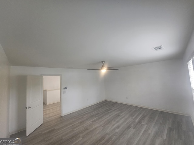 7253 Lacey Dr, Douglasville, GA 30134 - empty room with ceiling fan, wood finished floors, and baseboards