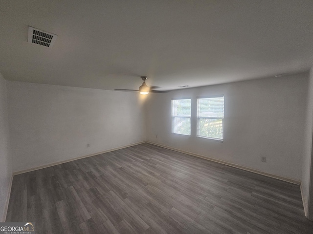 7253 Lacey Dr, Douglasville, GA 30134 - empty room featuring ceiling fan, wood finished floors, and baseboards