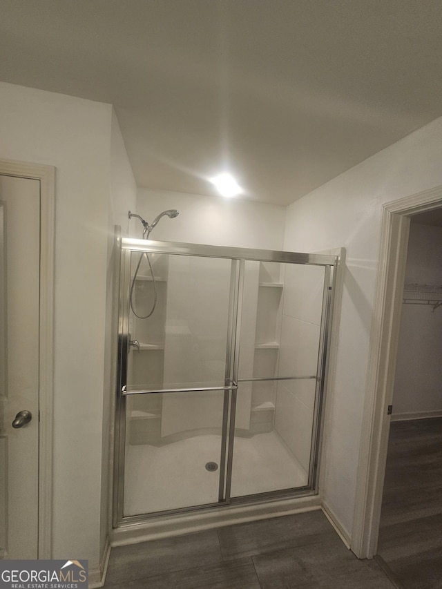 7253 Lacey Dr, Douglasville, GA 30134 - bathroom with a shower stall and baseboards