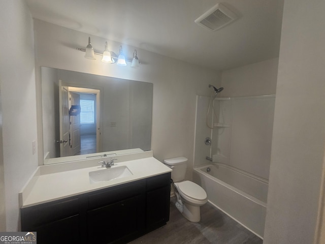 7253 Lacey Dr, Douglasville, GA 30134 - bathroom featuring toilet, wood finished floors, vanity, and bathing tub / shower combination