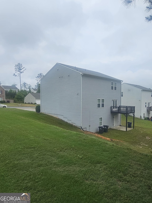 7253 Lacey Dr, Douglasville, GA 30134 - view of side of property with a lawn and a wooden deck