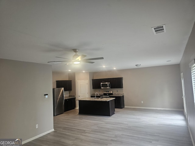 7253 Lacey Dr, Douglasville, GA 30134 - kitchen featuring stainless steel appliances, open floor plan, baseboards, and ceiling fan