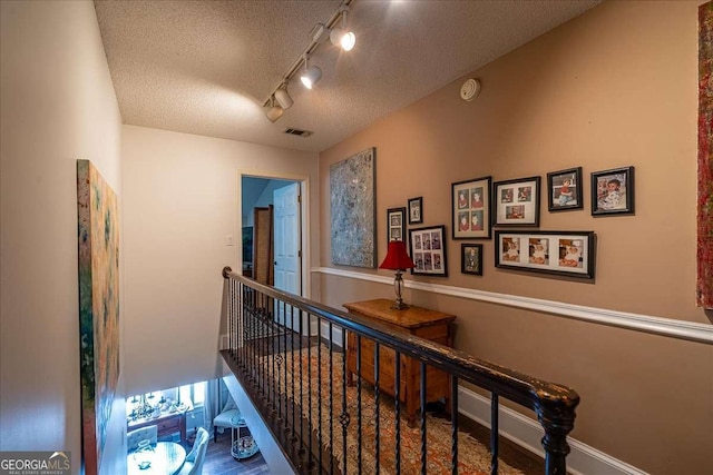 430 Milledge Cir, Athens, GA 30609 - corridor with a textured ceiling and rail lighting