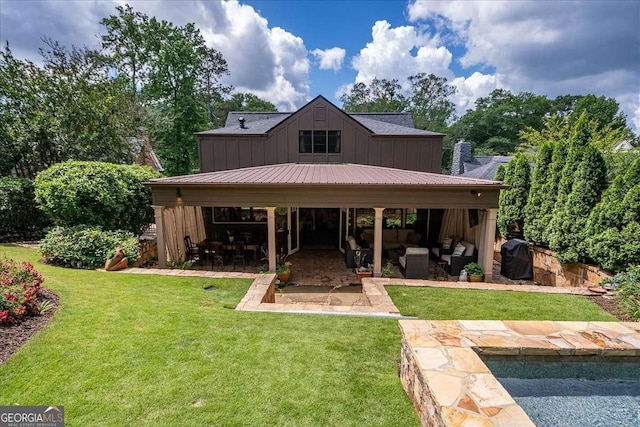 430 Milledge Cir, Athens, GA 30609 - rear view of house featuring board and batten siding, a patio area, a lawn, and outdoor lounge area