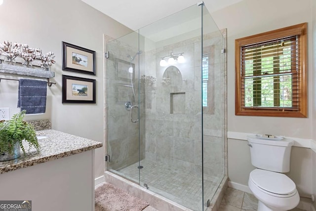 223 Denny Ridge Rd, Jasper, GA 30143 - full bathroom with a stall shower, baseboards, toilet, vanity, and tile patterned flooring