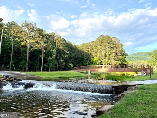 223 Denny Ridge Rd, Jasper, GA 30143 - surrounding community with a lawn, a forest view, and a deck with water view