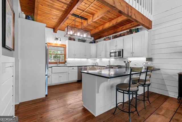 223 Denny Ridge Rd, Jasper, GA 30143 - kitchen with stainless steel appliances, wooden ceiling, a sink, a peninsula, and backsplash