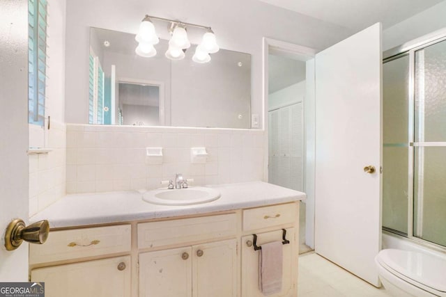 full bath with toilet and vanity