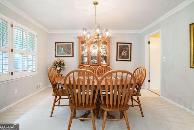 dining area featuring a chandelier, crown molding, light carpet, and baseboards