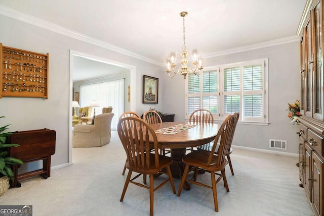 dining room featuring a chandelier, crown molding, light carpet, and baseboards