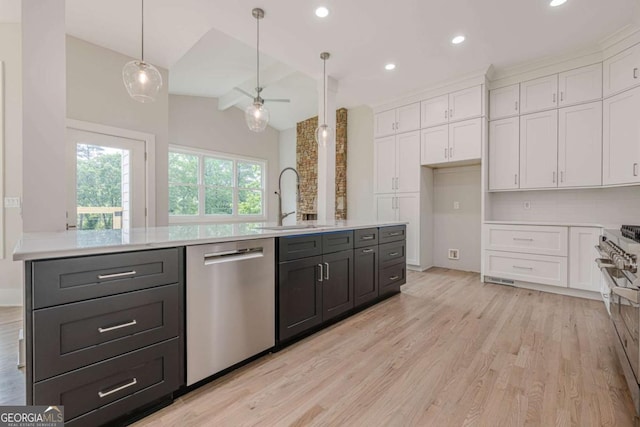 2555 Chattahoochee Ln, Cumming, GA 30041 - kitchen featuring appliances with stainless steel finishes, white cabinets, light countertops, light wood-style flooring, and recessed lighting