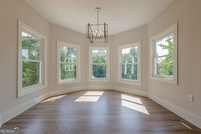 2555 Chattahoochee Ln, Cumming, GA 30041 - unfurnished dining area featuring a chandelier and wood finished floors