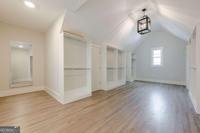 2555 Chattahoochee Ln, Cumming, GA 30041 - additional living space featuring wood finished floors, vaulted ceiling, and recessed lighting