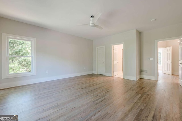 2555 Chattahoochee Ln, Cumming, GA 30041 - spare room featuring light wood-style flooring and ceiling fan