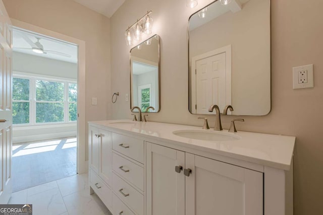 2555 Chattahoochee Ln, Cumming, GA 30041 - bathroom with double vanity and a ceiling fan
