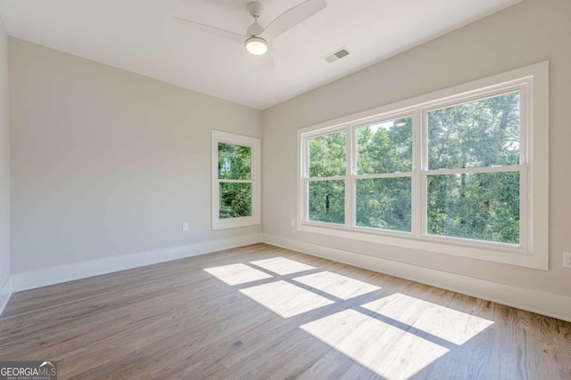 2555 Chattahoochee Ln, Cumming, GA 30041 - unfurnished room with light wood-style flooring and ceiling fan