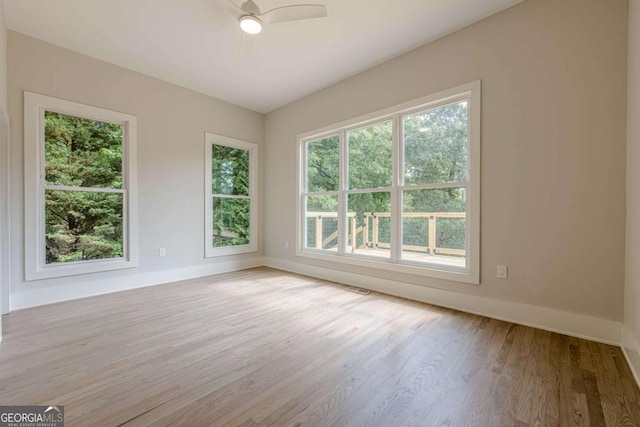 2555 Chattahoochee Ln, Cumming, GA 30041 - unfurnished room with wood finished floors and a ceiling fan