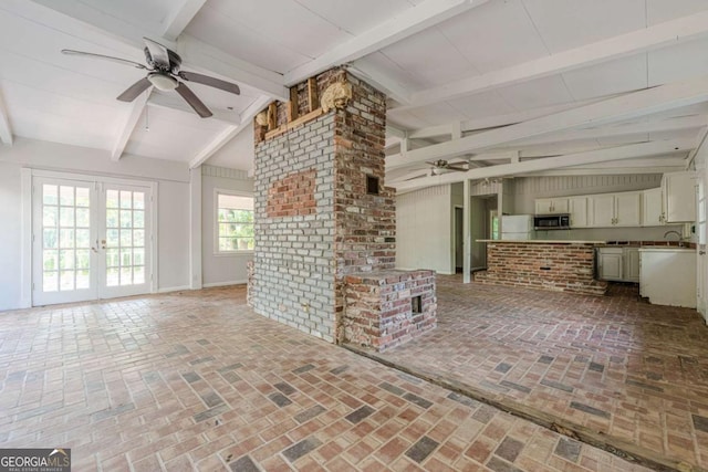 2555 Chattahoochee Ln, Cumming, GA 30041 - unfurnished living room featuring ceiling fan, brick flooring, and french doors