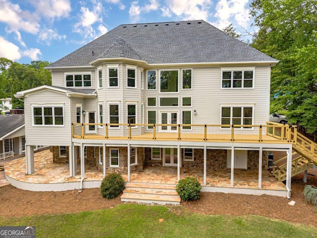 2555 Chattahoochee Ln, Cumming, GA 30041 - rear view of house featuring a patio area, a wooden deck, roof with shingles, and french doors