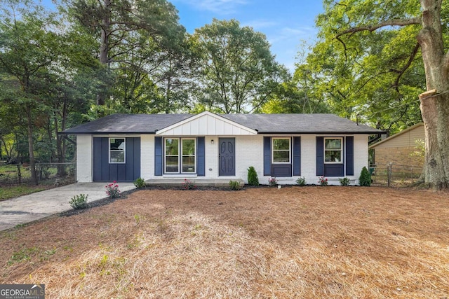 6932 Eunice Dr, Riverdale, GA 30274 - ranch-style home with brick siding, fence, and board and batten siding