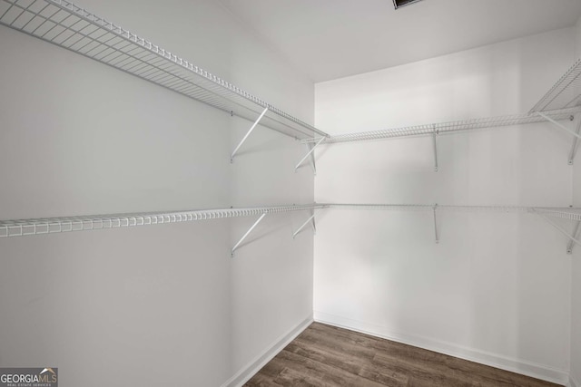 6932 Eunice Dr, Riverdale, GA 30274 - walk in closet featuring wood finished floors